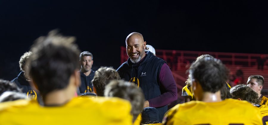 Berne Union's head coach talks to the team after a win.