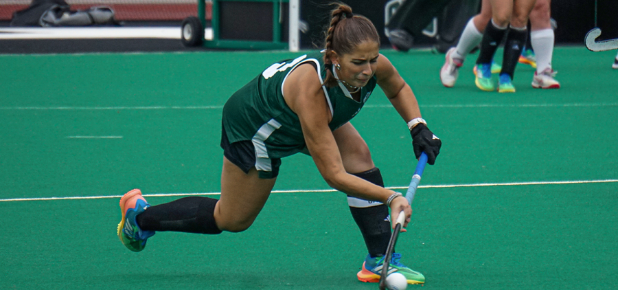 Ohio Field Hockey back Ava Hershberger passing the ball upfield against James Madison