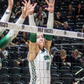 Ohio Volleyball middle blocker, Emily Waddell and opposite hitter Bailey Blair blocking a spike in win against Kent State