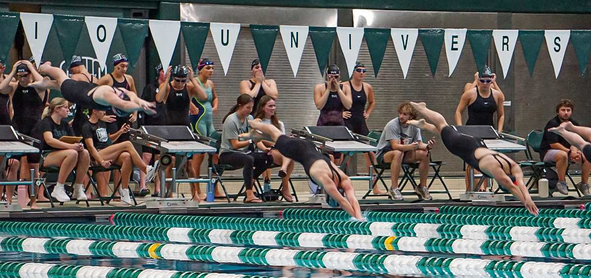 Ohio Swimming team diving into pool in meet against Illinois State