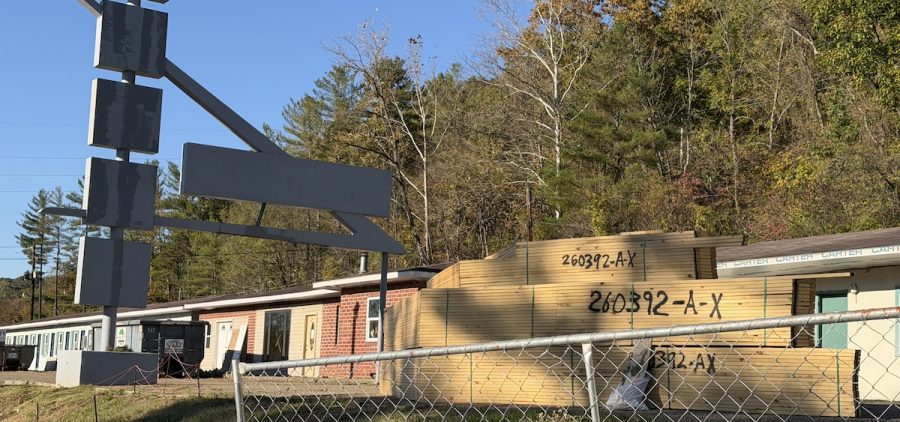 Lumber is stacked in front of the old Sunset Motel in Athens, which is being converted into a homeless shelter.