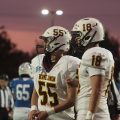 Two Berne Union players are watching the game.