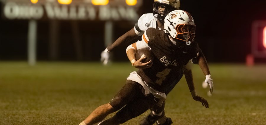 Beaver Eastern is running with the ball to get away from defenders