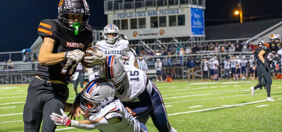 A Morgan player is tackling a New Lexington player