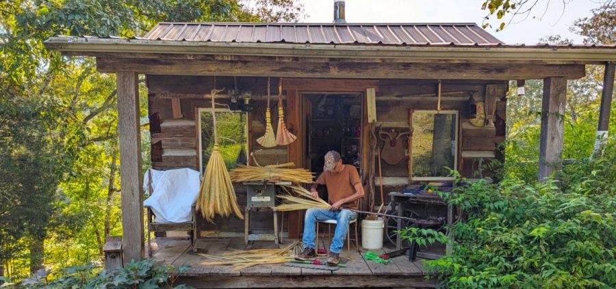 Curt Cable makes a broom on the porch of his workshop in Morgan County.