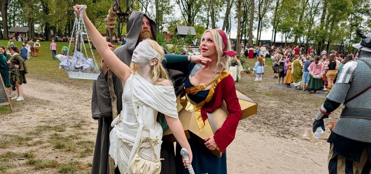 The Patton family from Cleveland dressed as album artwork. Shawn Patton (left) is the Hermit from "Led Zepplin IV", Amanda Patton (right) is dressed as the cover of Smashing Pumpkins' "Mellon Collie and the Infinite Sadness" and their 13-year-old daughter (center) is dressed as Lady Justice from Metallica's "...And Justice for All" at the Ohio Renaissance.