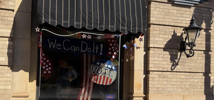 A storefront window in Wooster features a mannequin dressed up as Rosie the Riveter with the slogan on the window, "We can do it!" on Oct. 3, 2026, a reminder to patrons at Woosterfest, of the upcoming November elections.