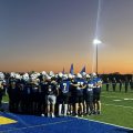 The Philo Electrics huddle up before their game against the Maysville Panthers.