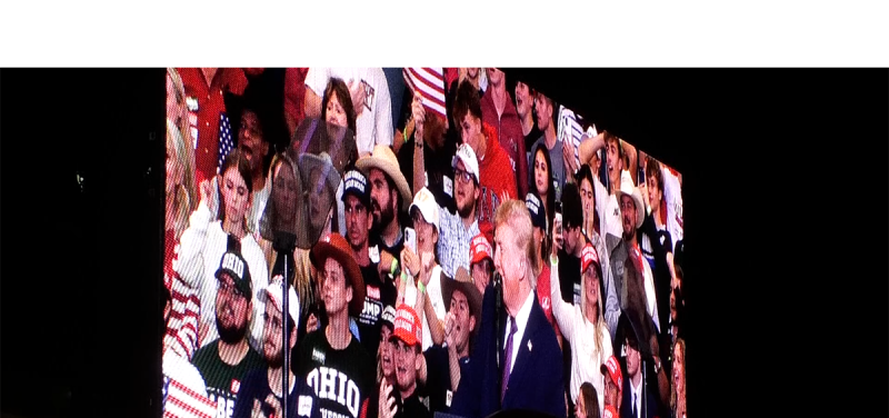 Donald Trump appears on a big screen outside of the Shoemaker Center in Chillicothe, Ohio.