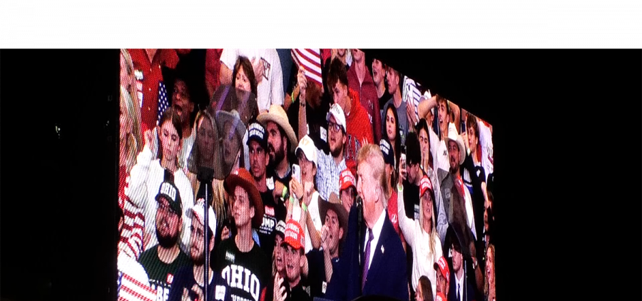 Donald Trump appears on a big screen outside of the Shoemaker Center in Chillicothe, Ohio.