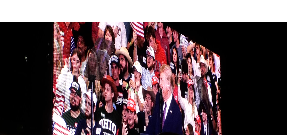 Donald Trump appears on a big screen outside of the Shoemaker Center in Chillicothe, Ohio.